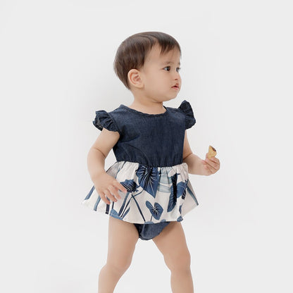 Sweet baby girl in a floral ruffle sleeve dress, matching her mom's outfit, showcasing girls fashion