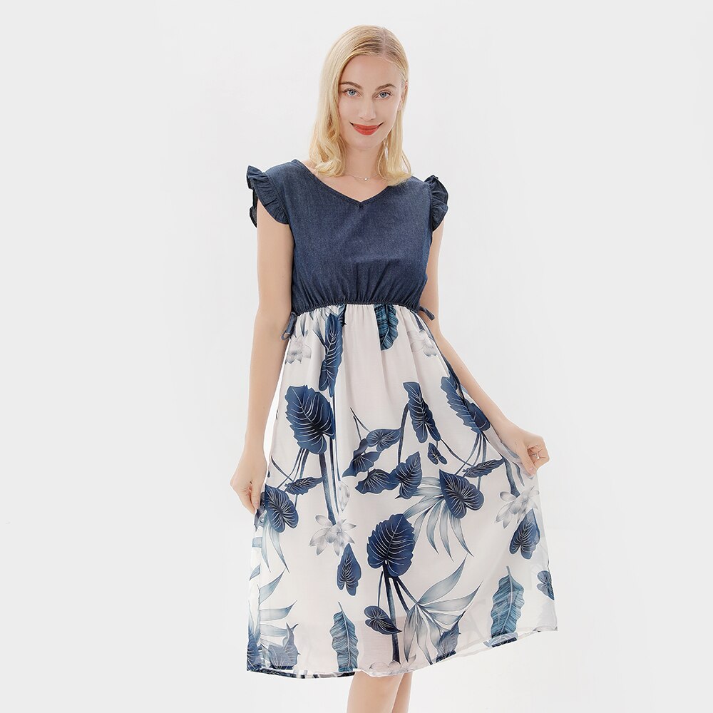Family matching floral dresses: mother holding daughter, both in cute ruffle sleeve outfits, 'mom daughter dress'