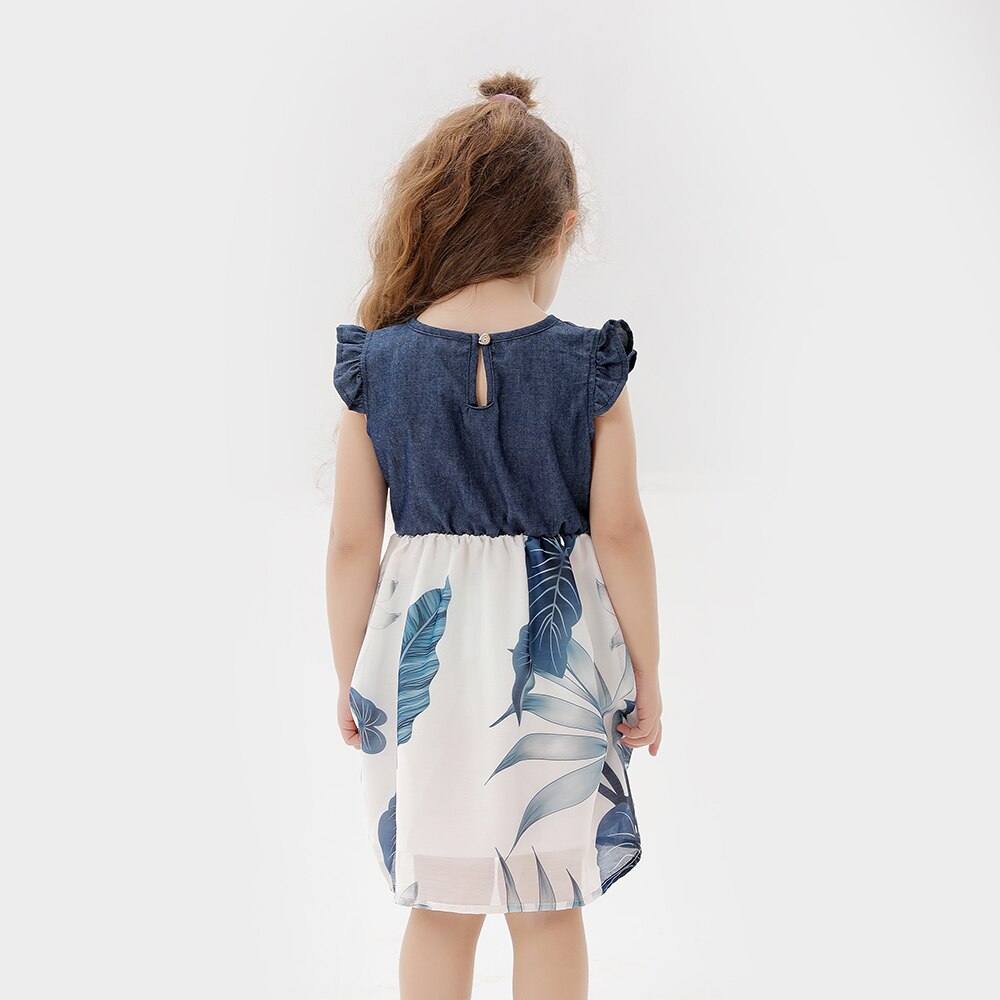 Detailed view of the floral pattern and ruffle sleeve on the matching mother daughter spring/autumn dresses