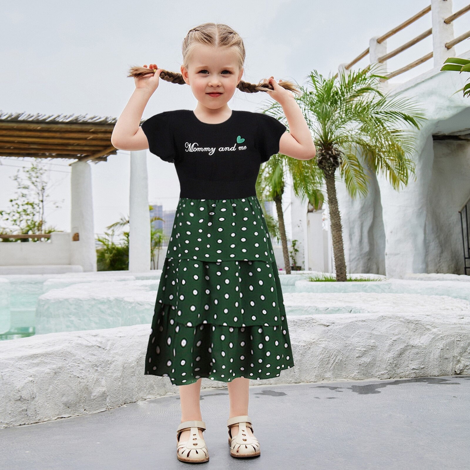 Womens apparel: Casual mother-daughter matching outfits with letter shirts and playful polka dot skirts for summer.