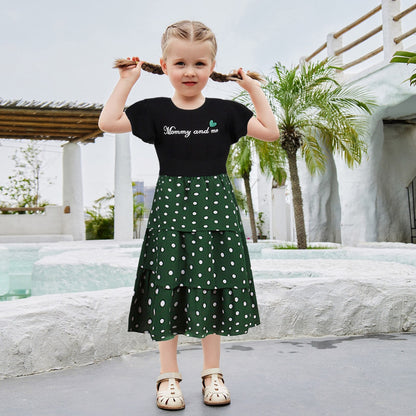 Womens apparel: Casual mother-daughter matching outfits with letter shirts and playful polka dot skirts for summer.