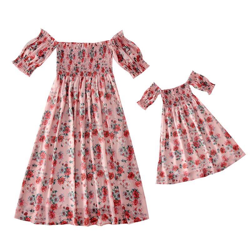 Closeup of a girl's off-shoulder floral terylene summer dress, perfect for family matching.