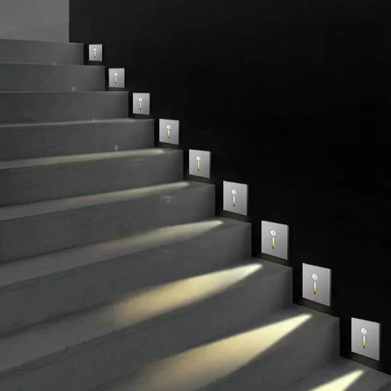 Sleek motion-activated LED accent light for stairs, enhancing home aesthetics.