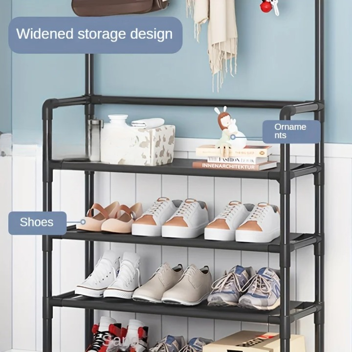 Entryway organizer featuring multiple coat hooks, shoe storage tiers, and top shelf; sturdy black steel frame.