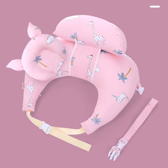 Ergonomic breast and bottle feeding pillow with plush headrest, designed for new mothers and babies