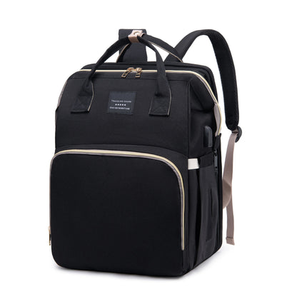 Foldable diaper bag backpack opening into a portable changing station, ideal for on-the-go parents