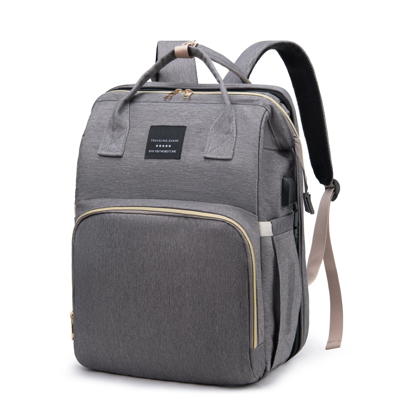 Parents setting up the multifunctional diaper bag into a portable changing bed for their infant