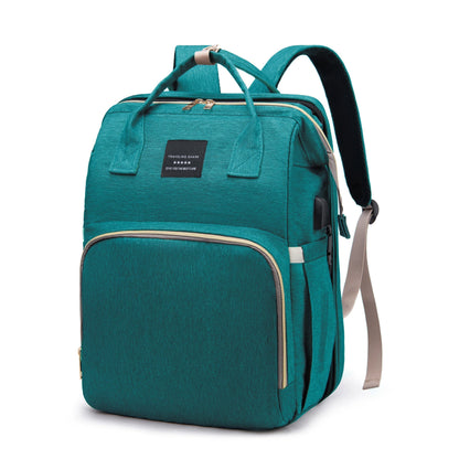 Close-up of the diaper bag's integrated portable bed, demonstrating its soft and secure baby-friendly space