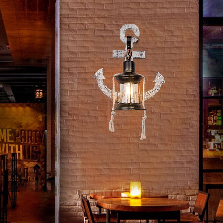 Vintage-inspired anchor wall sconce, NautiGlow, for rustic coastal or nautical themed home lighting.