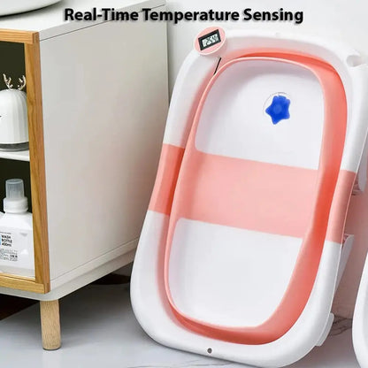 Gray infant bathtub with safety sensor and digital thermometer showing water temperature