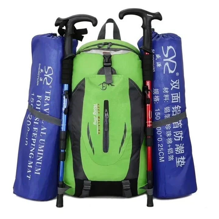 Unisex waterproof travel backpack by a lake, ready for outdoor gear, adventure, and durable travel use.