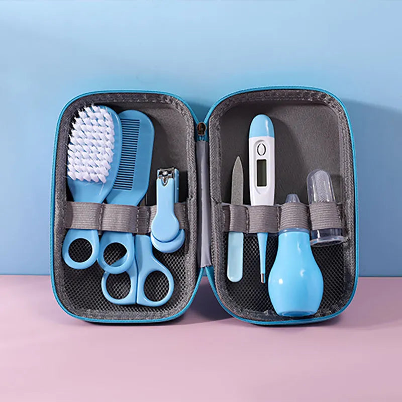 Full view of an open baby health and care kit, displaying all 8 essential grooming items