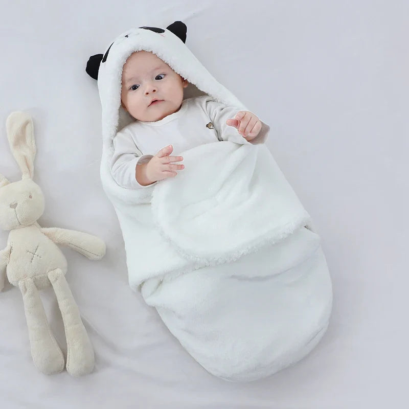 Cozy newborn swaddle sleeping bag with playful animal print design.