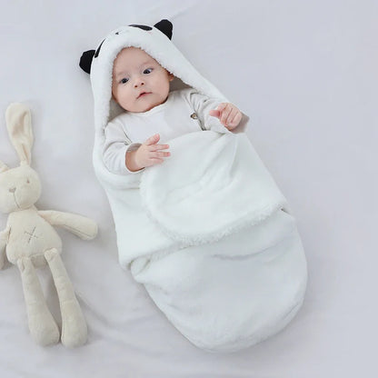 Cozy newborn swaddle sleeping bag with playful animal print design.