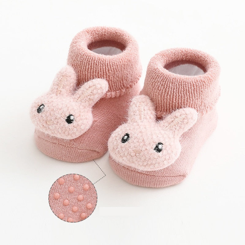 Detail shot of the elastic cuff on anti-slip infant socks, ensuring a snug fit without marks