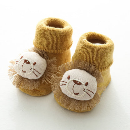 Yellow anti-slip toddler socks with textured grip, promoting confidence in new walkers