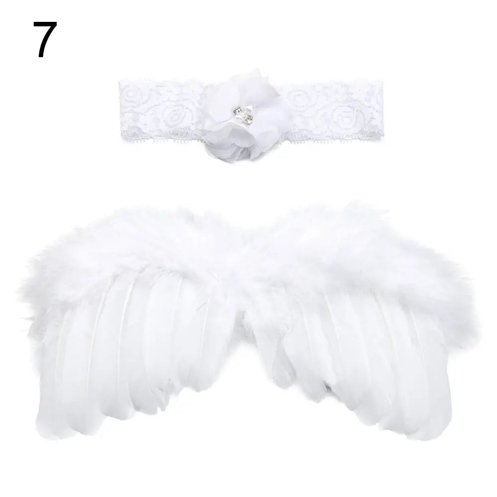 White feather angel wings for newborn photography, paired with pink and white flower headband