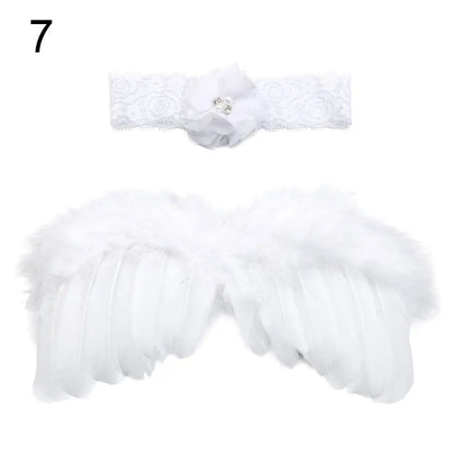 White feather angel wings for newborn photography, paired with pink and white flower headband