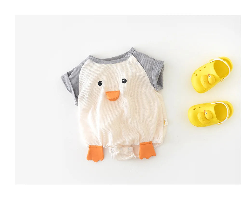 Detail shot of the shoulder snap on a baby's cotton short sleeve bodysuit, easy dressing feature.