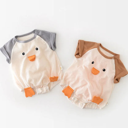Infant girl wearing a light pink cotton short sleeve onesie, perfect for summer baby clothes.