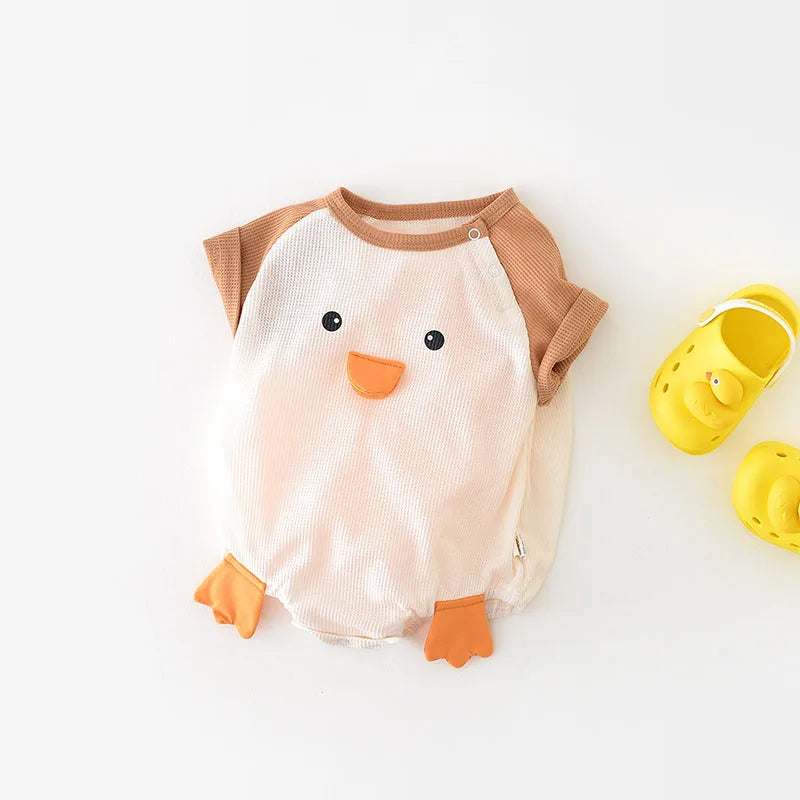 Close-up of the soft 100% cotton fabric of a baby bodysuit, highlighting texture for infant comfort.