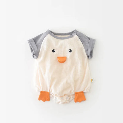 Happy baby crawling in a blue short sleeve cotton onesie, promoting active infant movement.