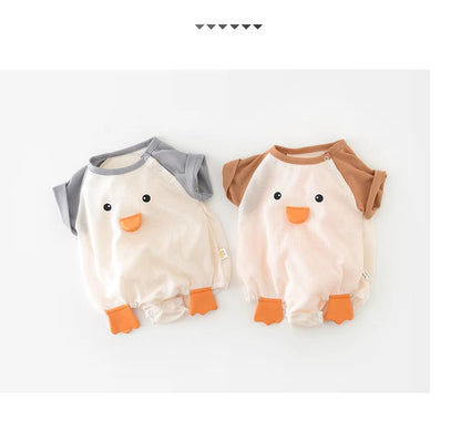 Baby laying on a blanket wearing a short sleeve cotton bodysuit, showcasing mobility and comfort.