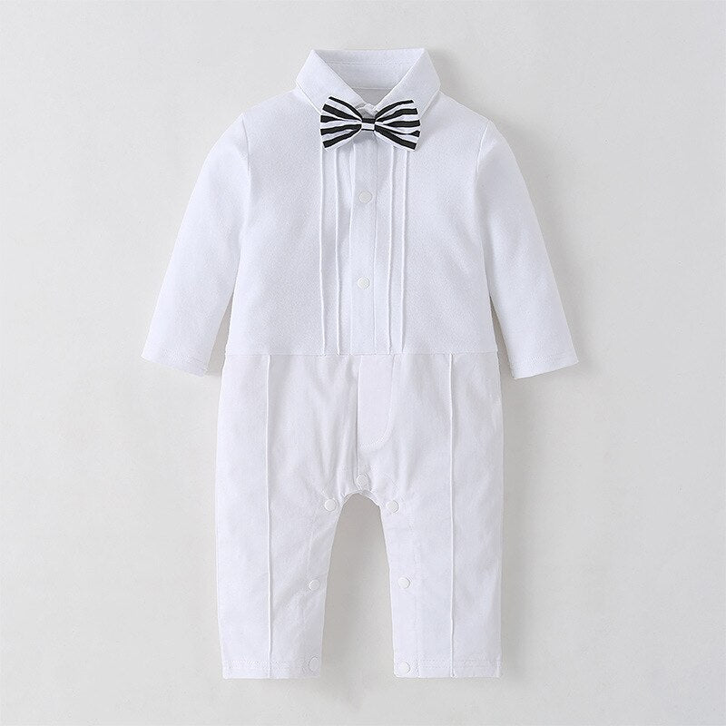 Close-up of newborn formal wear: white romper with blazer, ideal for christening or baptism