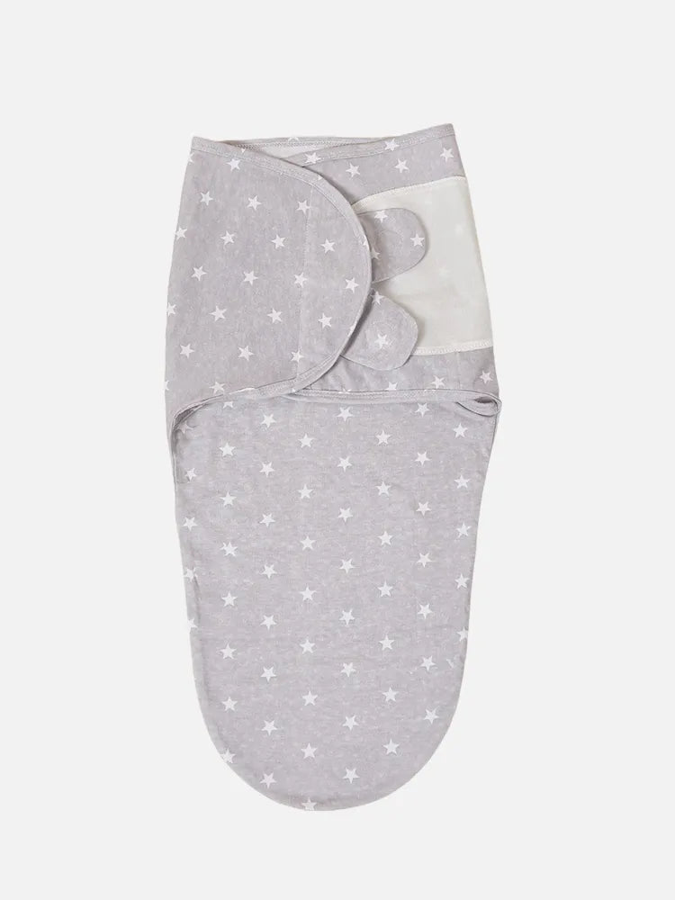 Folded newborn cotton swaddle sleepsack, ready for comfortable and safe baby sleep in any season.