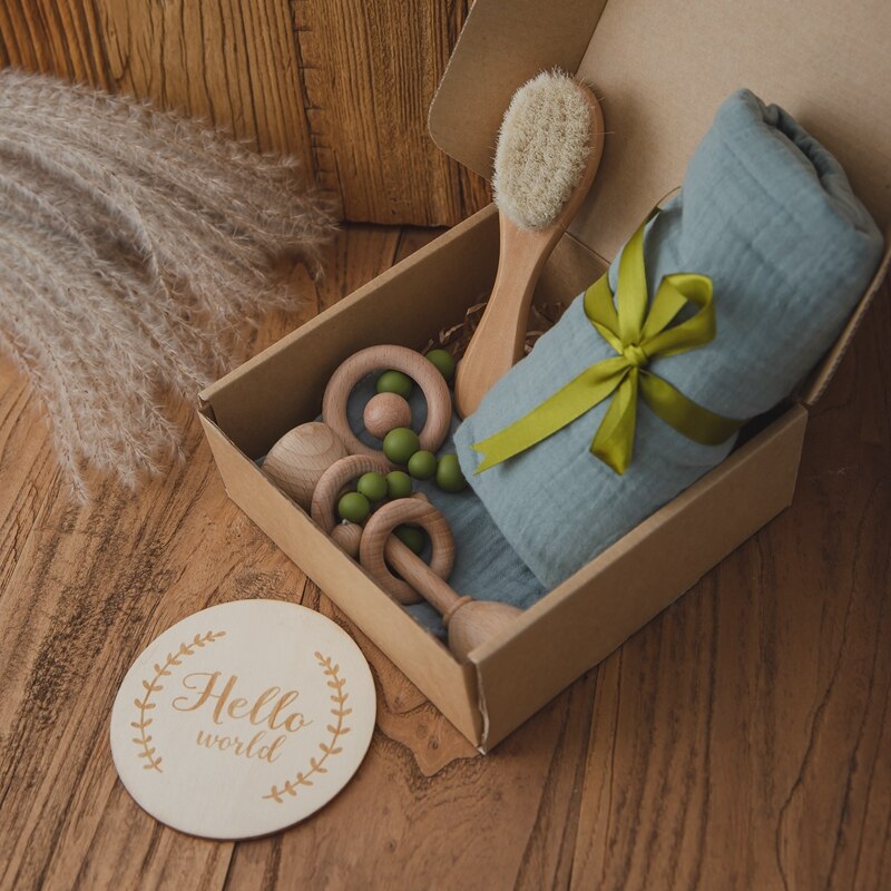 Premium newborn baby gift set for a baby shower, containing essential accessories