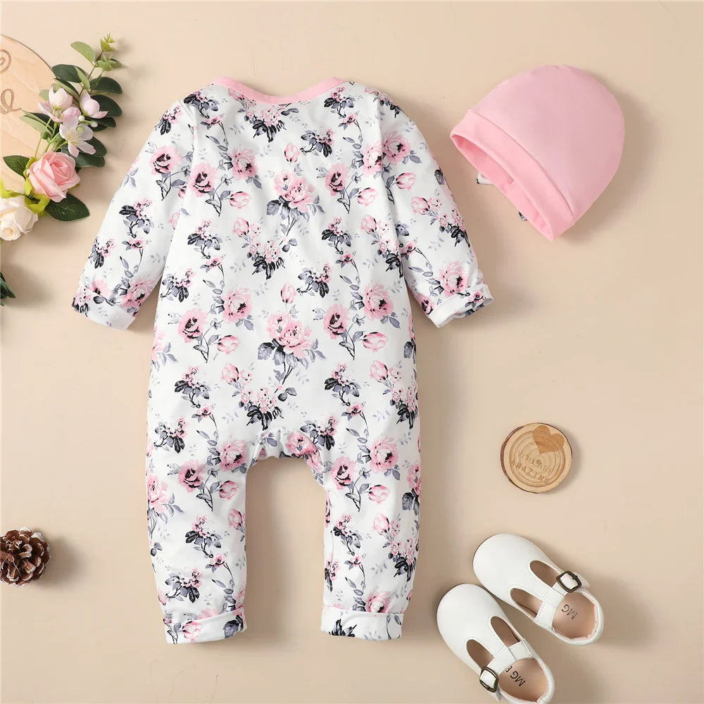 Infant girl's long sleeve floral romper with matching hat, cozy cotton blend set.