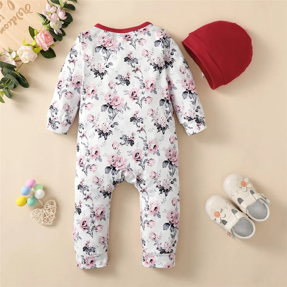 Floral cotton blend baby girl romper with coordinating hat for newborns.