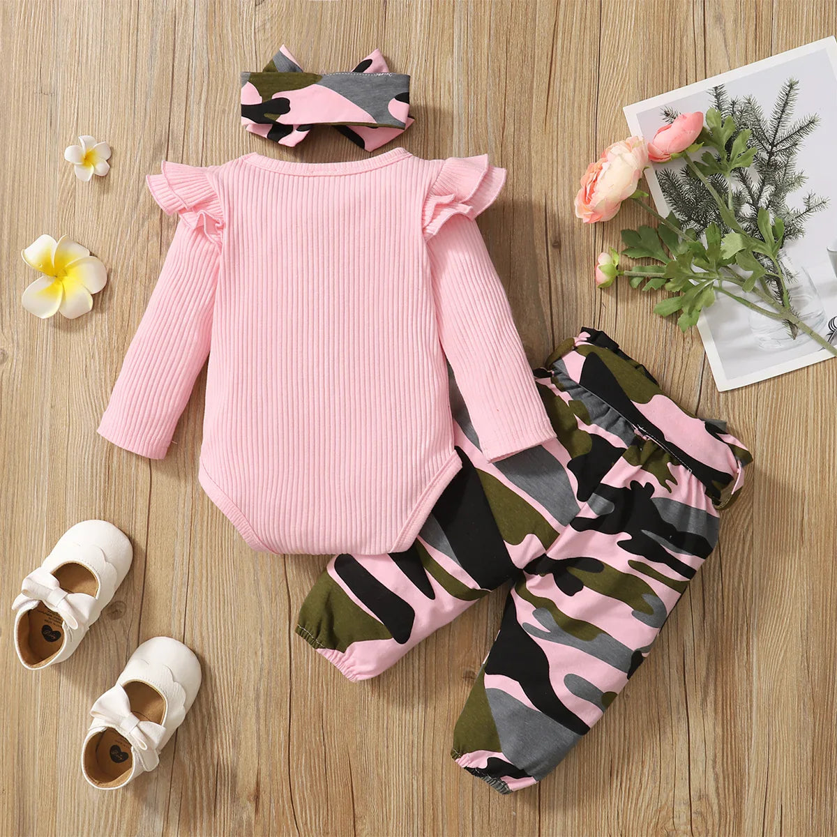 Close-up of a soft cotton blend baby coat from a newborn girl's clothes set.