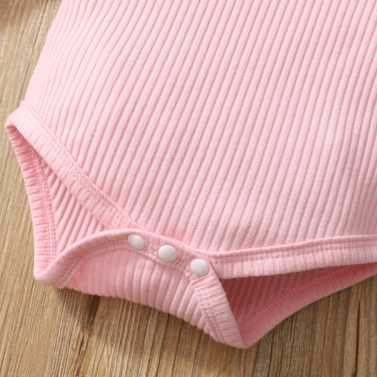 Entire newborn baby girl 3-piece outfit set, a charming baby pink design.