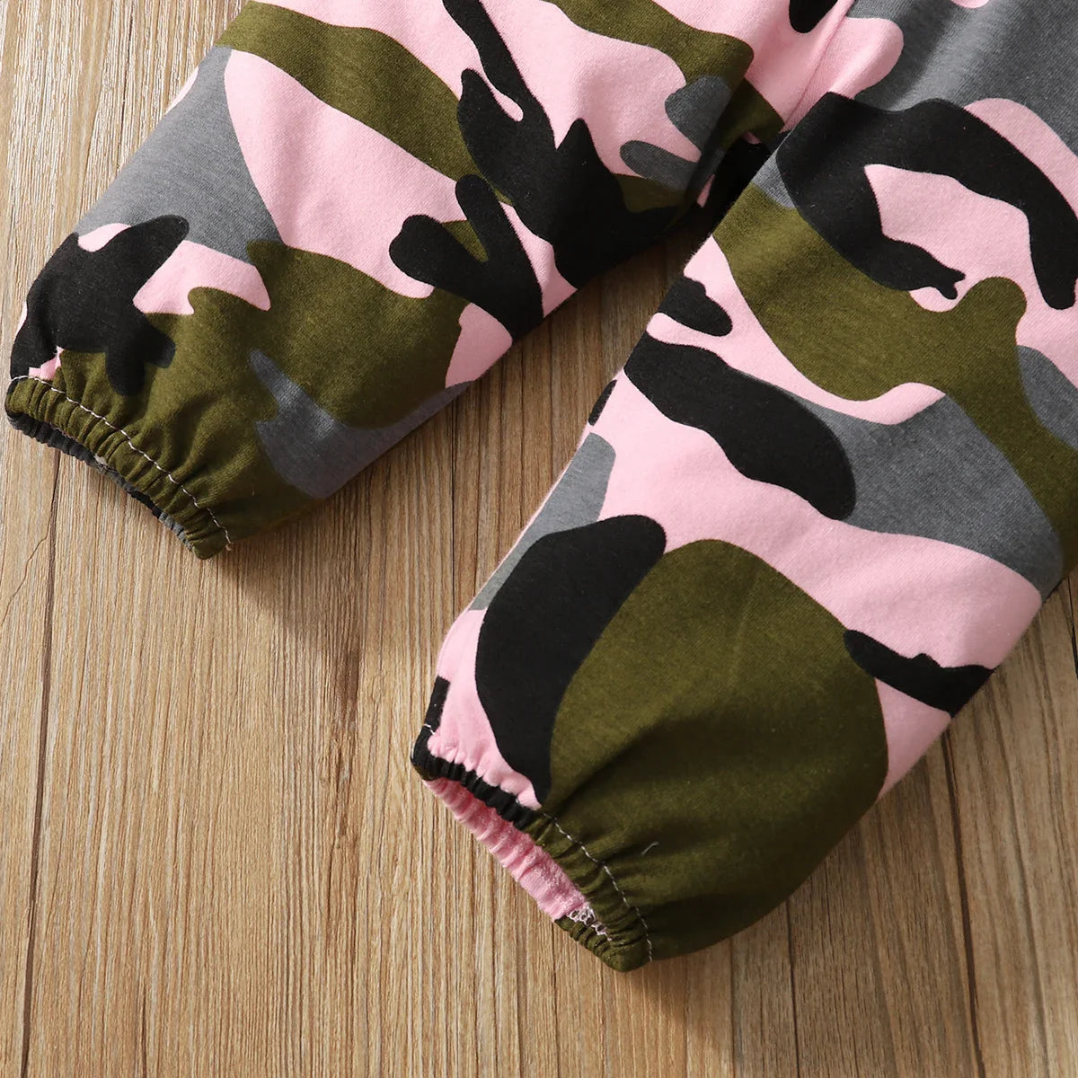 Detailed view of the fabric texture of a newborn outfit, cotton blend for comfort.