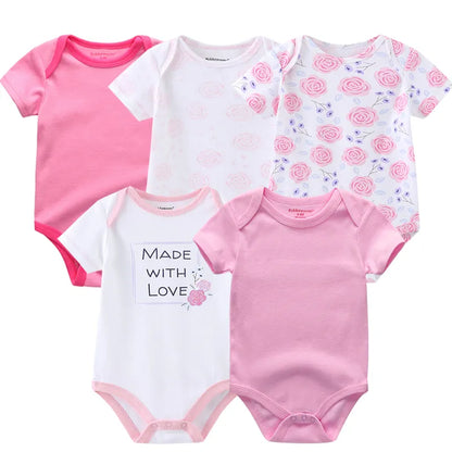 Baby girl modeling a cute short sleeve cotton bodysuit, a staple infant outfit