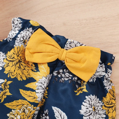 Adorable baby girl newborn outfit with a short-sleeve ruffle bodysuit, coordinating pants, & headband.