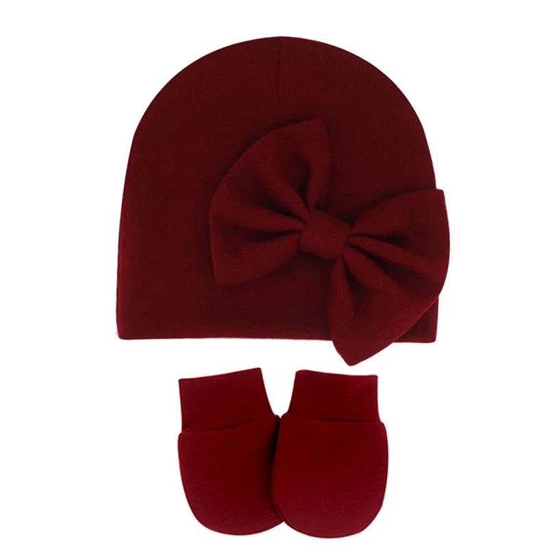 Newborn baby girl's cotton hat & mittens set, a perfect accessory for winter.