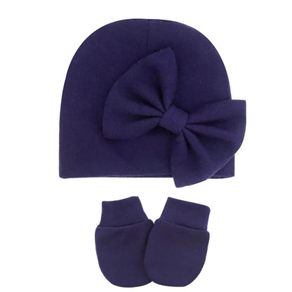 Cute baby girl's cotton hat and mittens, styled for comfort and warmth.