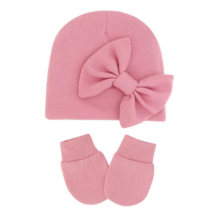 Baby girl's cotton hat and mitten set, designed for ultimate infant comfort.