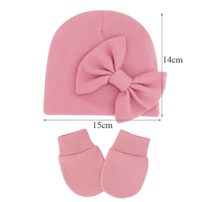 Cute baby gift: newborn girl's cotton hat with bow and matching mittens.