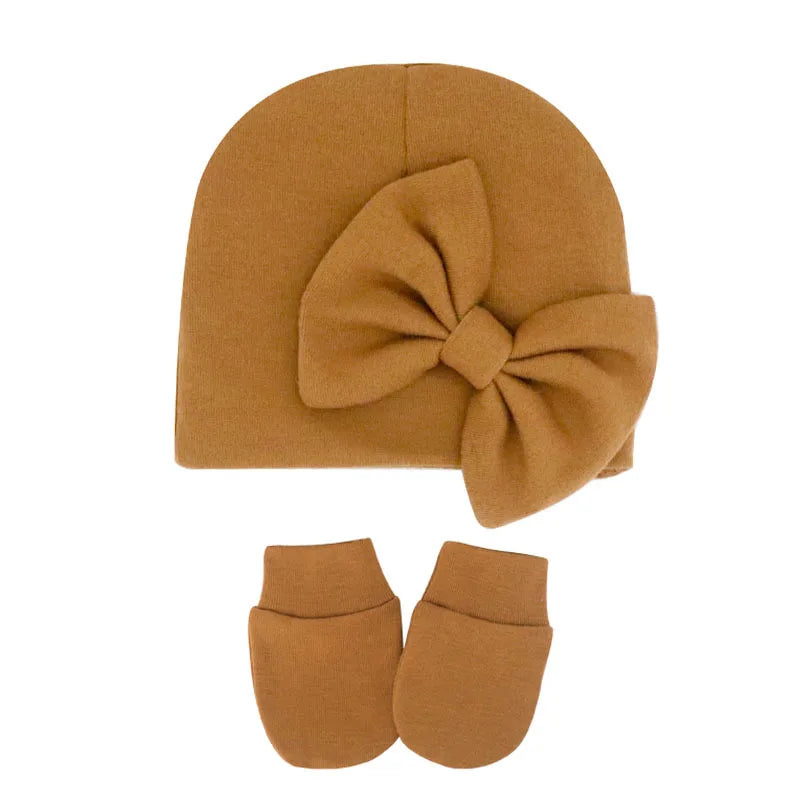 Pair of soft cotton baby mittens, perfect for keeping newborn hands warm.