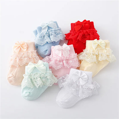 Newborn baby girl's white lace socks with a delicate princess bow, soft cotton blend infant apparel