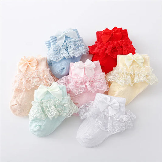 Newborn baby girl's white lace socks with a delicate princess bow, soft cotton blend infant apparel