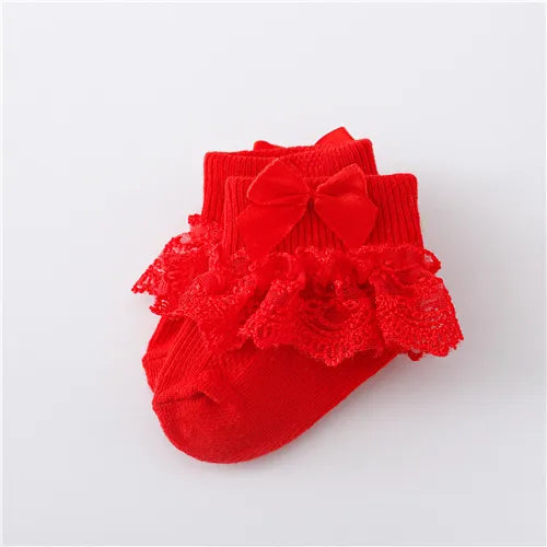 Front view of baby girl's lace socks with a pretty princess bow, soft and comfortable