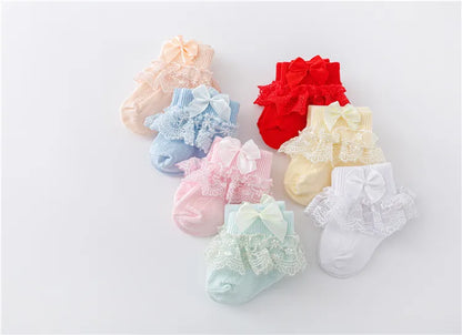 Elegant baby girl's lace socks, enhanced with a classic princess bow, newborn essential