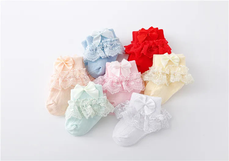 Textured lace baby socks for girls, paired with a beautiful princess bow, cotton blend