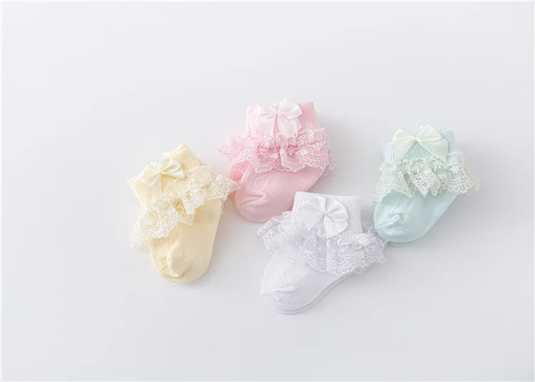 Cute newborn girls socks with lace trim and an adorable princess bow, baby accessories