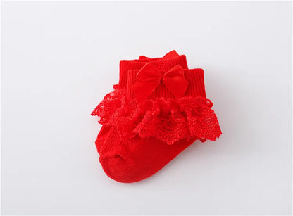 Newborn baby girl's accessory: white lace socks with a charming princess bow, soft material