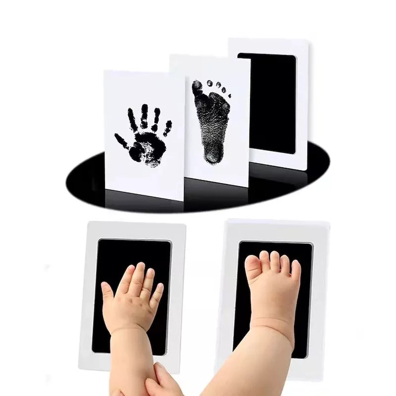 Newborn baby handprint and footprint kit with safe, non-toxic ink pad and imprint cards for lasting memories.